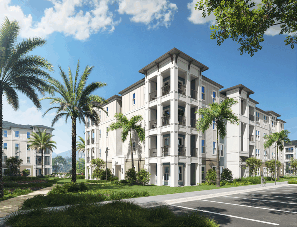 Modern four-story apartment buildings with balconies, surrounded by palm trees and landscaping under a blue partly cloudy sky, showcase quality work by multifamily general contractors specializing in market rate developments.