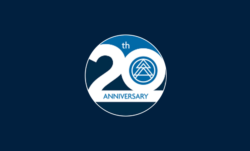 A circular blue and white logo with "20th ANNIVERSARY" text and a geometric symbol inside the zero, celebrating excellence in multifamily construction and market rate developments.